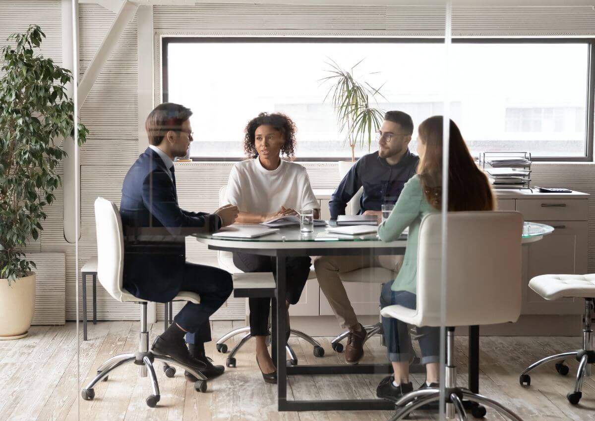 a group of people sitting around a table